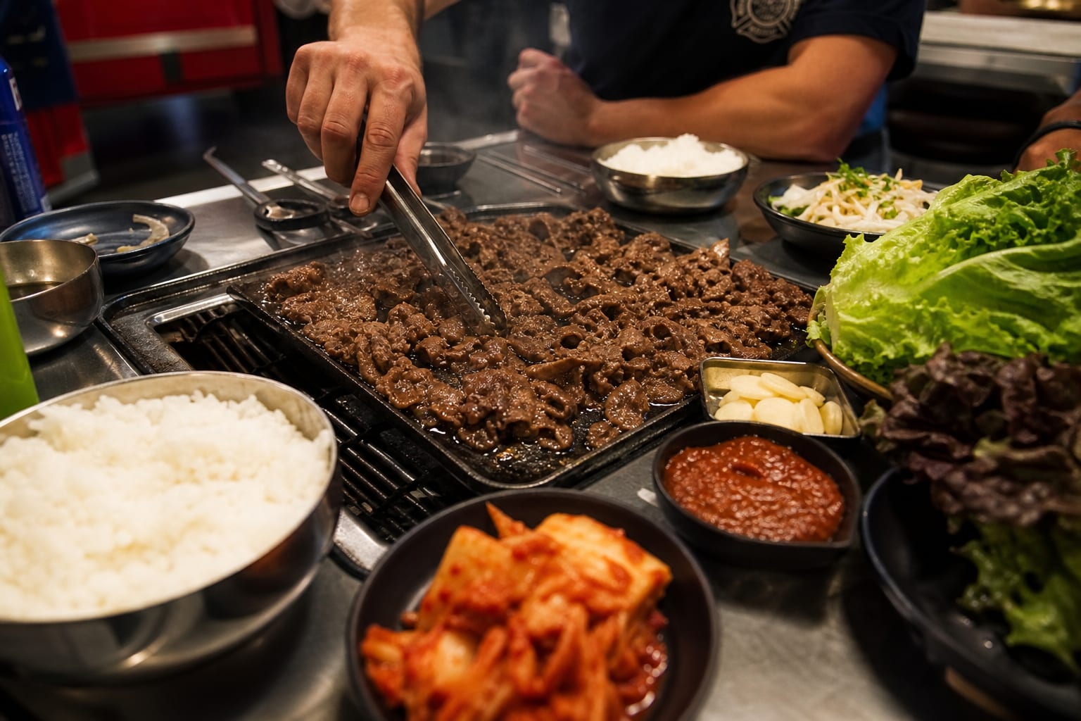 Korean Bulgogi Grill Night — ribeye steak, green onions, butter lettuce, kimchi, ssamjang, rice, and garlic